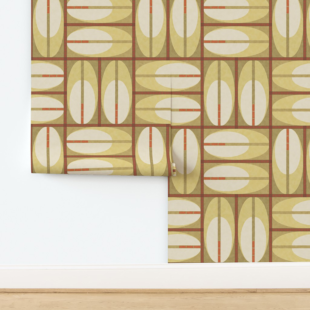 The artwork features a repeating geometric pattern of symmetrical shapes resembling elongated, curved diamonds or petals in various shades of blue and green. Each shape is split vertically with one half filled with a light blue and the other half filled with green or darker blue. The background is a light, almost pastel blue, which provides a soft yet vibrant backdrop. One of the blue shapes near the upper left contains a white starburst element, adding a focal point of brightness to the composition. The overall design conveys a modern, mid-century aesthetic with clean lines and harmonious color contrasts.